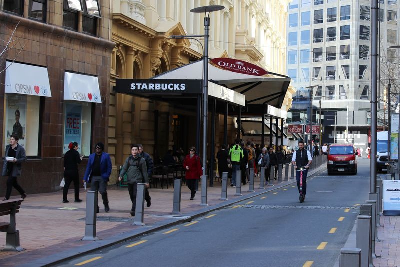 &copy; Reuters. People walk outside a Starbucks cafe on Lambton Quay street in Wellington, New Zealand July 23, 2020. Picture taken July 23, 2020. REUTERS/Praveen Menon