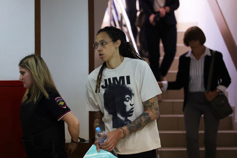 &copy; Reuters. U.S. basketball player Brittney Griner, who was detained in March at Moscow's Sheremetyevo airport and later charged with illegal possession of cannabis, is escorted before a court hearing in Khimki outside Moscow, Russia July 1, 2022. REUTERS/Evgenia Nov