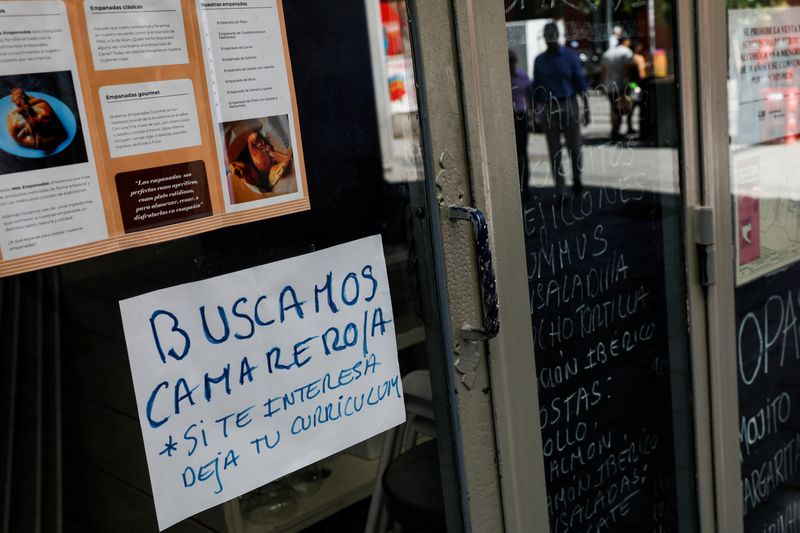 &copy; Reuters. A sign that reads "Waiter needed. If interested, drop CV"  is posted on the window of a restaurant in central Madrid, Spain, May 31, 2022. Picture taken May 31, 2022. REUTERS/Susana Vera