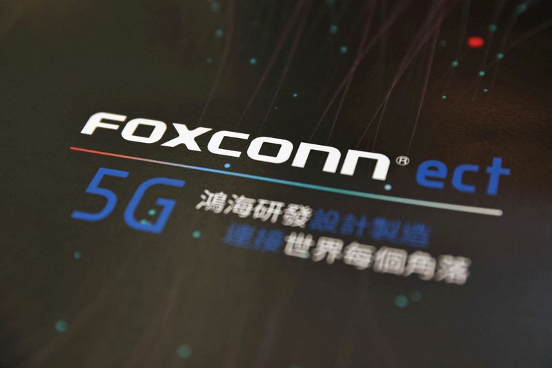 &copy; Reuters. FILE PHOTO: A poster with a logo of Foxconn is seen at the IEEE Global Communications Conference in Taipei. Taiwan, December 9, 2020. REUTERS/Ann Wang