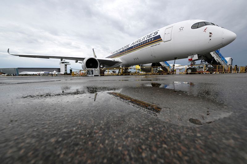 &copy; Reuters. FILE PHOTO: A Singapore Airlines plane is seen among the planes in the static display at the Singapore Airshow in Singapore, February 16, 2022. REUTERS/Caroline Chia