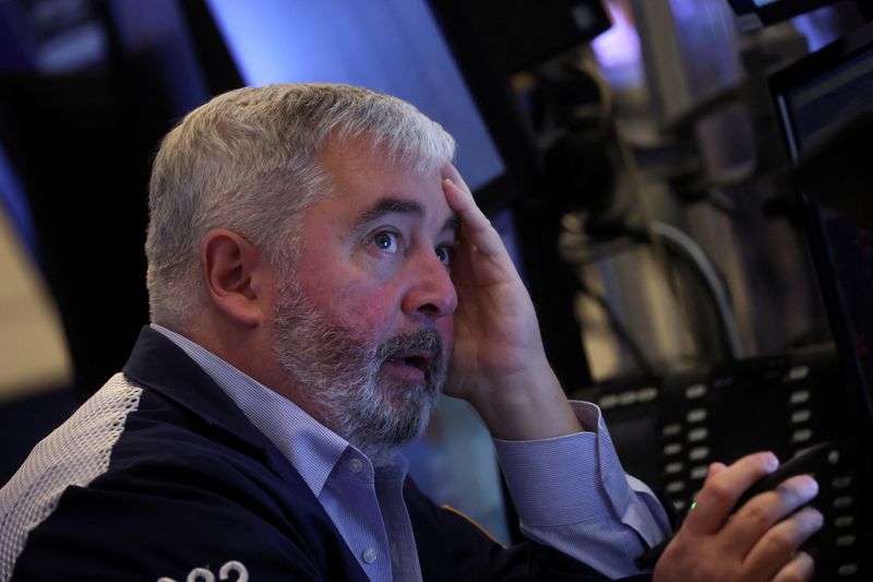 &copy; Reuters. FILE PHOTO: A trader works on the floor of the New York Stock Exchange (NYSE) in New York City, U.S., June 16, 2022. REUTERS/Brendan McDermid