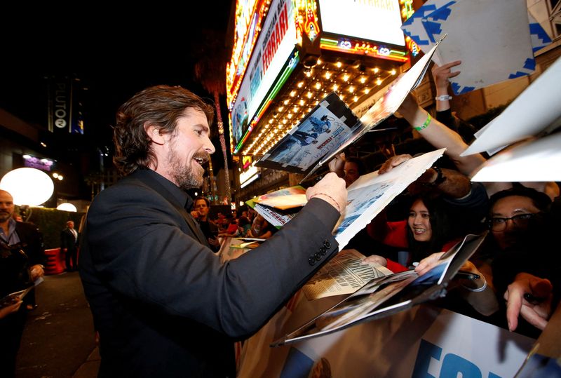 &copy; Reuters. FILE PHOTO: Cast member Christian Bale signs autographs at a special screening for the movie "Ford v Ferrari" in Los Angeles, California, U.S., November 4, 2019. REUTERS/Mario Anzuoni/File Photo