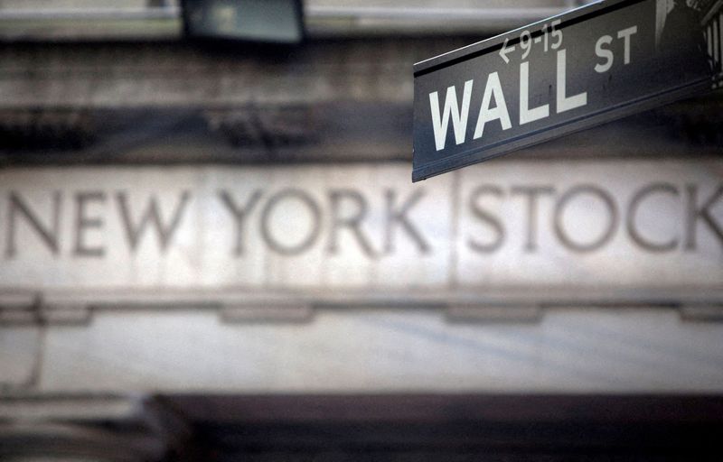 &copy; Reuters. FILE PHOTO: A Wall Street sign is pictured outside the New York Stock Exchange in New York, October 28, 2013. REUTERS/Carlo Allegri