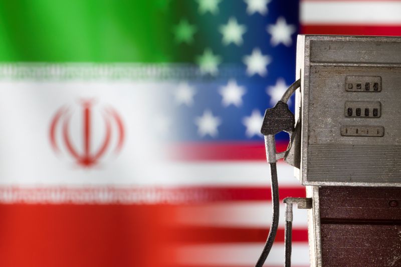&copy; Reuters. Model of petrol pump is seen in front of U.S. and Iran flag colors in this illustration taken March 25, 2022. REUTERS/Dado Ruvic/Illustration