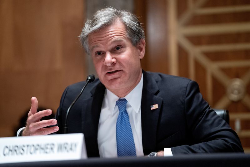 &copy; Reuters. FBI Director Christopher Wray testifies during a Senate Homeland Security and Governmental Affairs hearing to discuss security threats 20 years after the 9/11 attacks, in Washington, D.C., U.S. September 21, 2021. Greg Nash/Pool via REUTERS/Files
