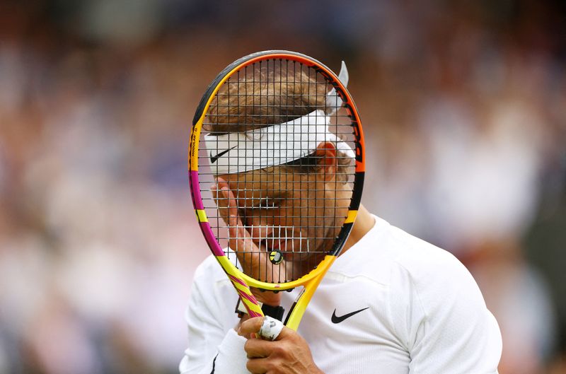 &copy; Reuters. Tennis - Wimbledon - All England Lawn Tennis and Croquet Club, London, Britain - July 6, 2022  Spain's Rafael Nadal reacts during his quarter final match against Taylor Fritz of the U.S. REUTERS/Hannah Mckay     