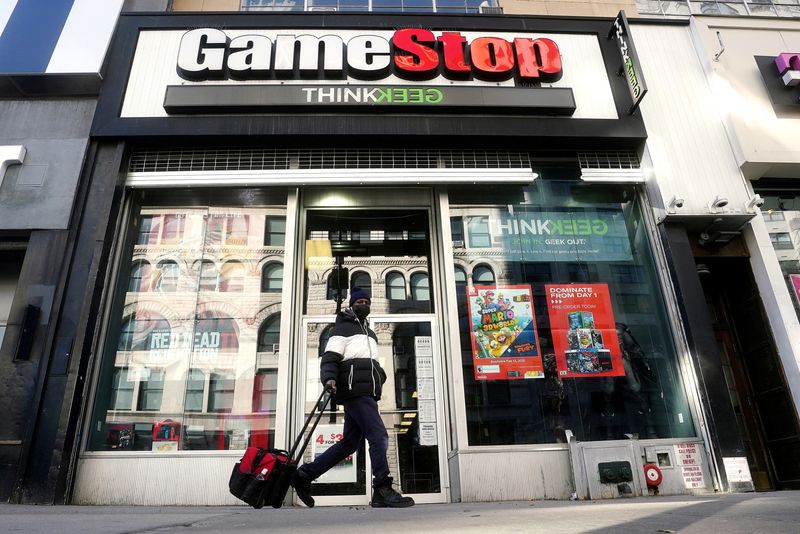 &copy; Reuters. FILE PHOTO: A person walks past a GameStop store in the Manhattan borough of New York City, New York, U.S., January 29, 2021. REUTERS/Carlo Allegri