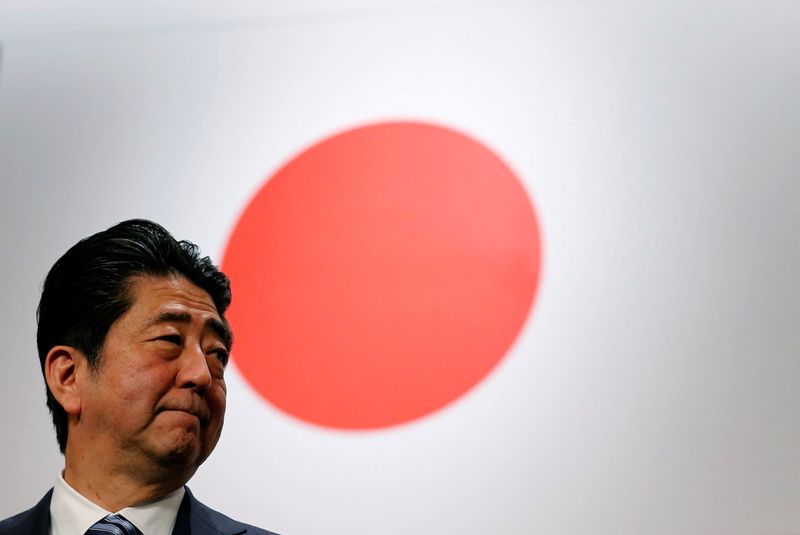 &copy; Reuters. FILE PHOTO: Japan's Prime Minister Shinzo Abe stands in front of Japan's national flag after his ruling Liberal Democratic Party's (LDP) annual party convention in Tokyo, Japan, March 5, 2017.  REUTERS/Toru Hanai