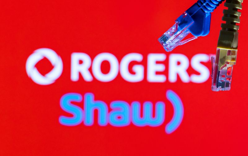 &copy; Reuters. Ethernet cables are seen in front of Rogers and Shaw Communications logos in this illustration taken, July 8, 2022. REUTERS/Dado Ruvic/Illustrations