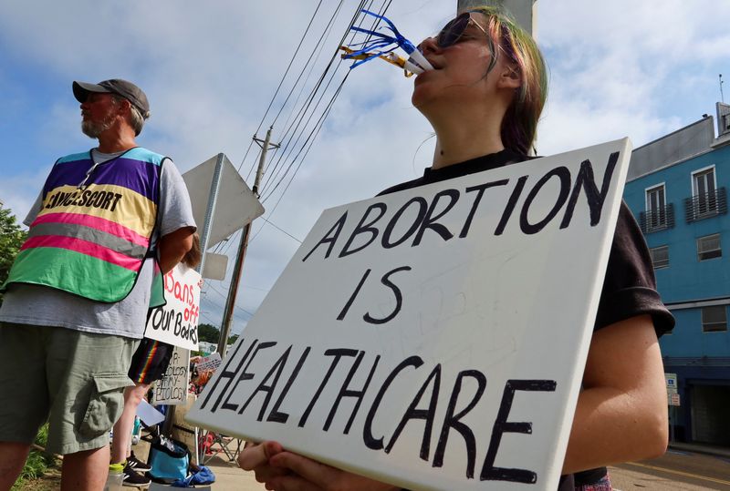 &copy; Reuters. FILE PHOTO: An abortion rights activist blows a party horn at anti-abortion protesters outside the Jackson Women's Health Organization, on the final day when abortions are carried out, before the clinic permanently closes, in Jackson, Mississippi, U.S. Ju