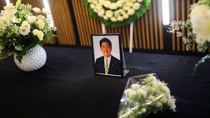 &copy; Reuters. A photo of late former Japanese Prime Minister Shinzo Abe, who was shot while campaigning for a parliamentary election, is placed on the table at the Japanese Embassy in Mexico City, Mexico July 11, 2022. REUTERS/Edgard Garrido