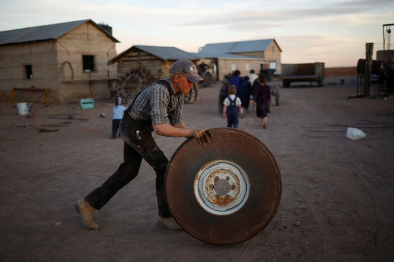 &copy; Reuters. A young man rolls a tractor wheel in the Mennonite community of El Sabinal, Chihuahua, Mexico, April 22, 2021.  REUTERS/Jose Luis Gonzalez/File Photo        