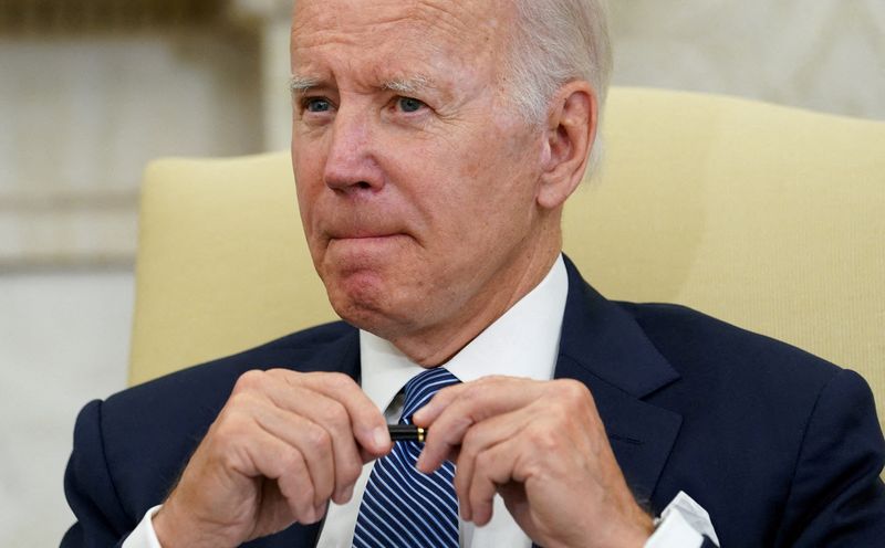 Biden approval rating rises modestly from record low