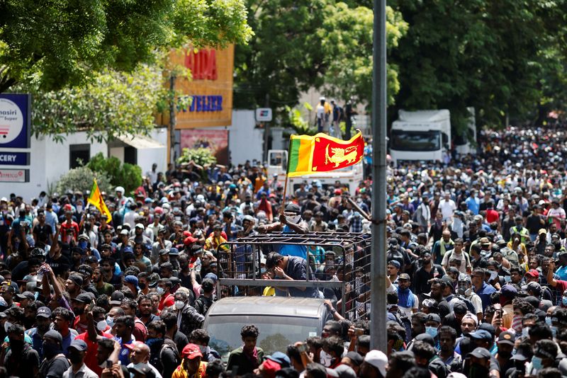 Sri Lankans storm prime minister's office, demanding he quit as well