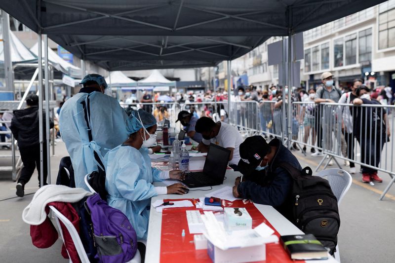 &copy; Reuters. FILE PHOTO: Healthcare workers register people to be tested for the coronavirus disease (COVID-19) as Peru raised its pandemic alert level in various cities and tightened some restrictions due, to a third wave of infections caused by the spread of the Omi