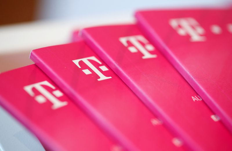&copy; Reuters. FILE PHOTO: Brochures with the logo of Deutsche Telekom AG are pictured at the shop in the headquarters of German telecommunications giant in Bonn, Germany, February 19, 2019.   REUTERS/Wolfgang Rattay/File Photo
