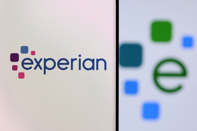 &copy; Reuters. FILE PHOTO: Experian logo is seen on a smartphone in front of displayed same logo in this illustration taken, December 1, 2021. REUTERS/Dado Ruvic/Illustration
