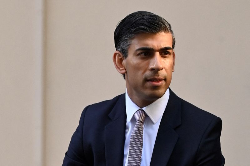 &copy; Reuters. FILE PHOTO: Former Chancellor of the Exchequer Rishi Sunak walks for a radio interview in London, Britain, July 14, 2022. REUTERS/Toby Melville