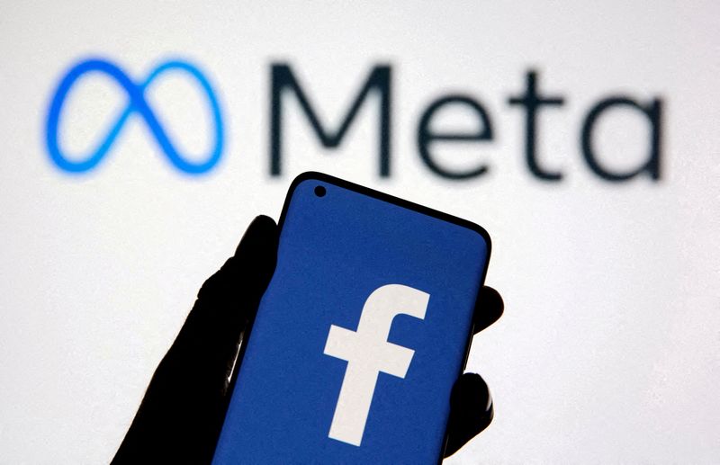 &copy; Reuters. FILE PHOTO: A smartphone with Facebook's logo is seen with new rebrand logo Meta in this illustration taken October 28, 2021. REUTERS/Dado Ruvic/Illustration