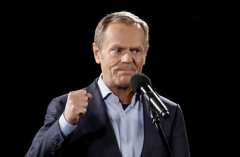 Polish central bank threatens legal action against Tusk over 'threats'