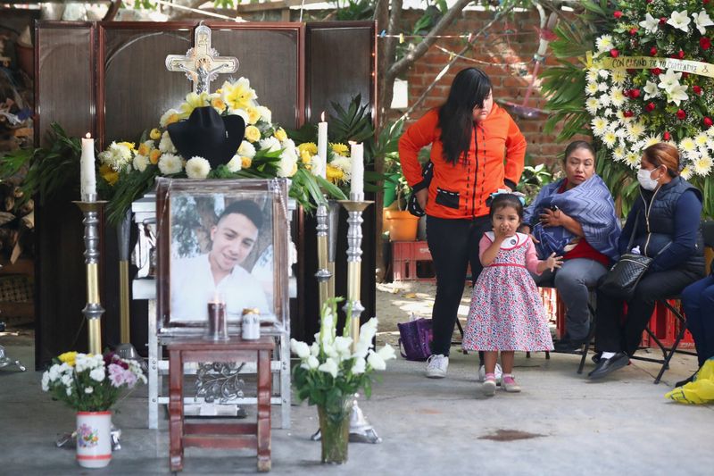 Mexican families hold funerals for migrants who died in Texas trailer tragedy