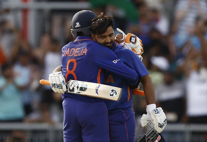 &copy; Reuters. Cricket - One Day International Series - England v India - Old Trafford Cricket Ground, Manchester, Britain - July 17, 2022 India's Rishabh Pant celebrates reaching his century with Ravindra Jadeja Action Images via Reuters/Jason Cairnduff