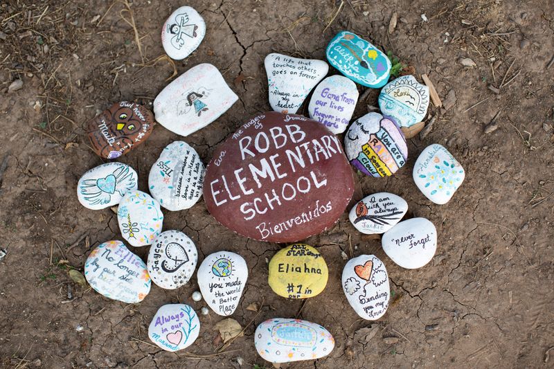 &copy; Reuters. Painted stones are placed at a memorial outside Robb Elementary School the day after the video showing the May shooting inside the school released, in Uvalde, Texas, U.S., July 13, 2022. REUTERS/Kaylee Greenlee Beal