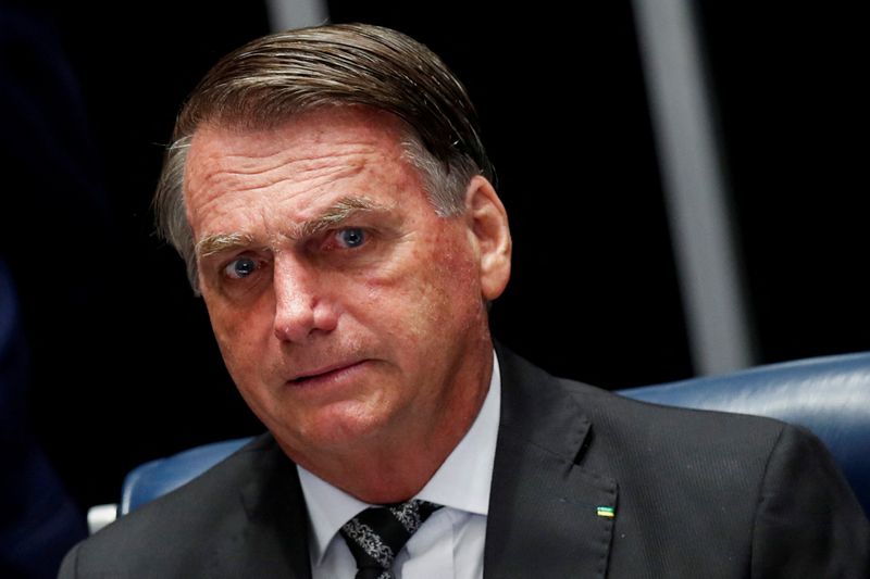 &copy; Reuters. Brazil's President Jair Bolsonaro looks on during a session of the National Congress to decree amends to the constitution to bypass the country's spending cap and boost social benefits, in Brasilia, Brazil July 14, 2022. REUTERS/Adriano Machado