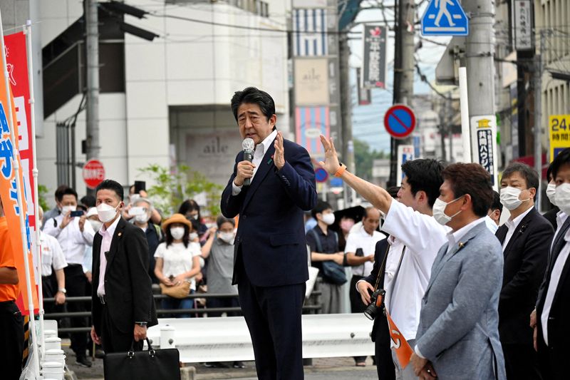 &copy; Reuters. FILE PHOTO: Former Japanese Prime Minister Shinzo Abe makes a speech before he was shot from behind by a man in Nara, western Japan July 8, 2022 in this photo taken by The Asahi Shimbun. The Asahi Shimbun/via REUTERS 