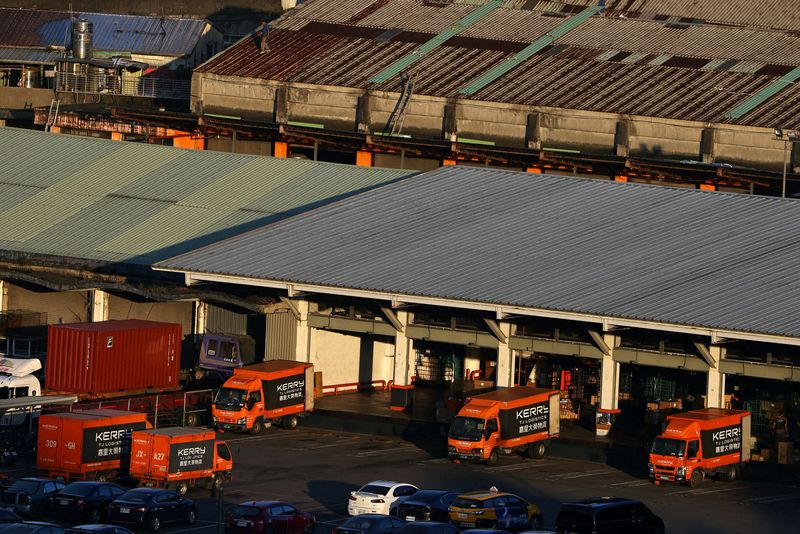 &copy; Reuters. FILE PHOTO: Trucks loaded with packages are seen in Keelung, Taiwan, November 18, 2020. REUTERS/Ann Wang