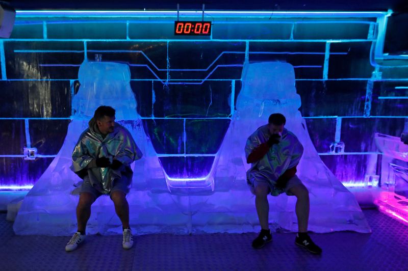 &copy; Reuters. Customers drink from glasses made of ice inside the Ice Pub in Prague, Czech Republic, July 19, 2022. REUTERS/David W Cerny