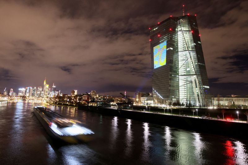 &copy; Reuters. FILE PHOTO: A symphony of light illuminates the south facade of the European Central Bank (ECB) headquarters in Frankfurt, Germany, December 30, 2021. REUTERS/Wolfgang Rattay