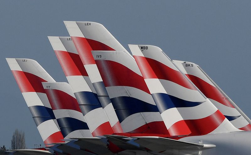 &copy; Reuters. FILE PHOTO: Tail Fins of British Airways planes are seen parked at Heathrow airport as the spread of the coronavirus disease (COVID-19) continues, London, Britain, March 31, 2020. REUTERS/Toby Melville/