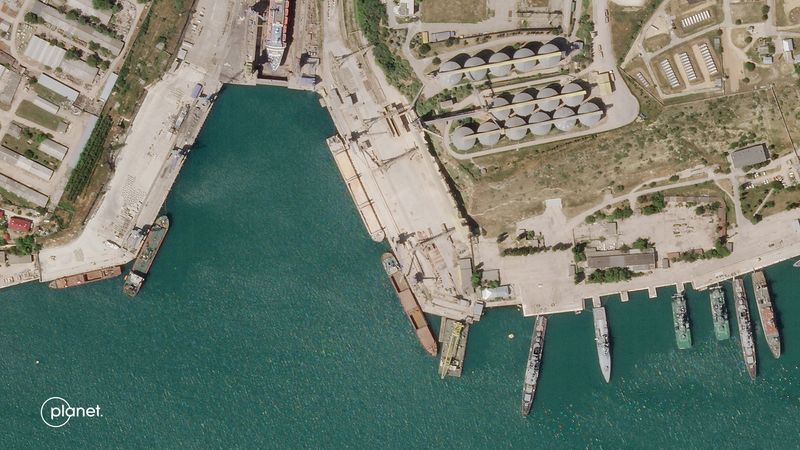 &copy; Reuters. A satellite image from Planet Labs PBC shows a cargo ship that a Reuters analysis found matches the Russian-flagged bulk carrier SV Nikolay (top ship) at a grain terminal in Sevastopol, Crimea June 18, 2022. Planet Labs PBC/Handout via REUTERS