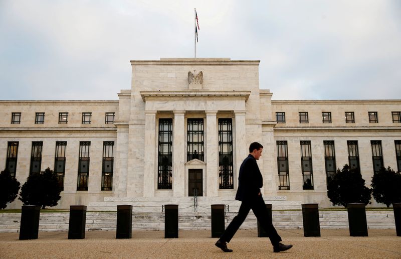 &copy; Reuters. FILE PHOTO: A man walks past the Federal Reserve Bank in Washington, D.C., U.S. December 16, 2015.   REUTERS/Kevin Lamarque/File Photo            