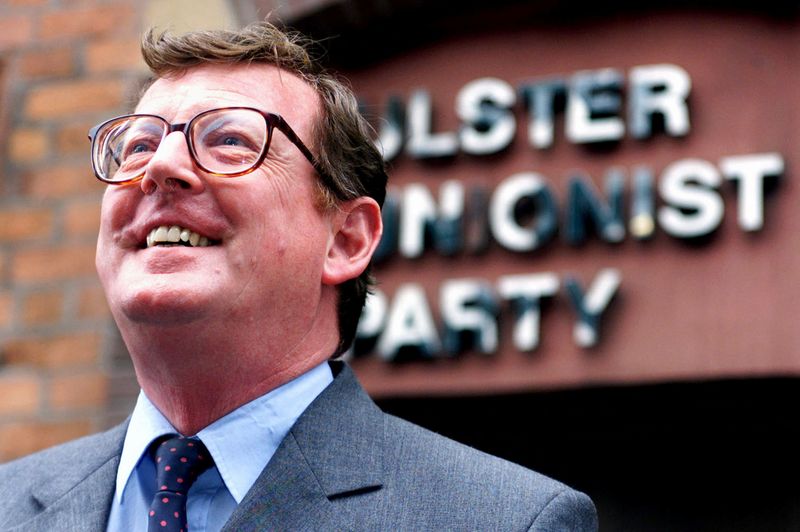 &copy; Reuters. FILE PHOTO: Ulster Unionist Party leader David Trimble smiles after a meeting held with his party in UUP Headquarters in Belfast city centre, September 4. REUTERS/File Photo