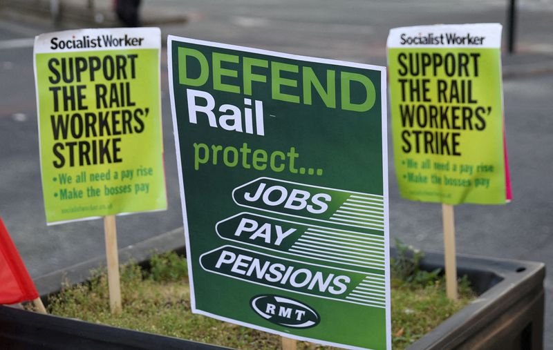 &copy; Reuters. FILE PHOTO: Placards are seen near a union picket line on the first day of a national rail strike at Manchester Piccadilly Station in Manchester, Britain, June 21, 2022. REUTERS/Phil Noble/File Photo