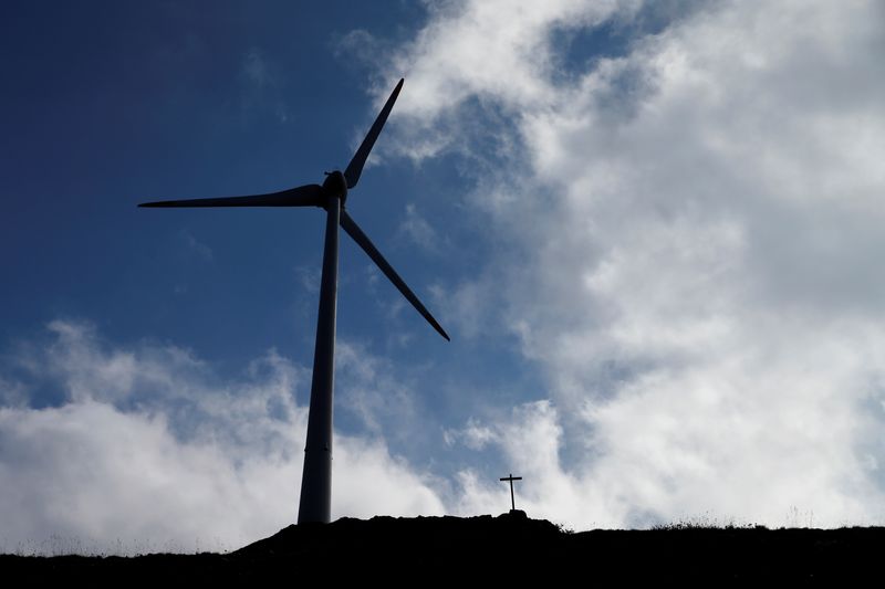 &copy; Reuters. FILE PHOTO: A wind turbines is pictured next to a cross at Swisswinds farm, Europe's highest wind farm at 2500m, before the topping out ceremony near the Nufenen Path in Gries, Switzerland, September 30, 2016. REUTERS/Denis Balibouse