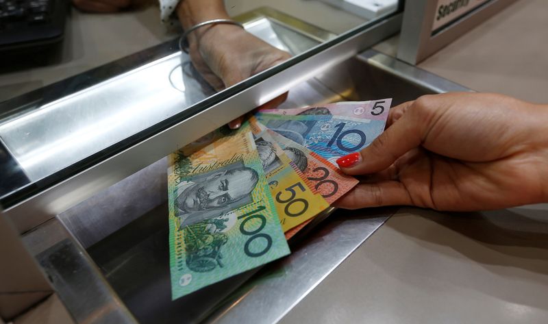 &copy; Reuters. FILE PHOTO: Australian dollar denominations shown in a photo illustration at a currency exchange in Sydney, Australia, June 7, 2016. REUTERS/Jason Reed