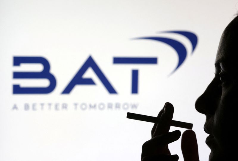 &copy; Reuters. A woman poses with a cigarette in front of BAT (British American Tobacco) logo in this illustration taken July 26, 2022. REUTERS/Dado Ruvic/Illustration