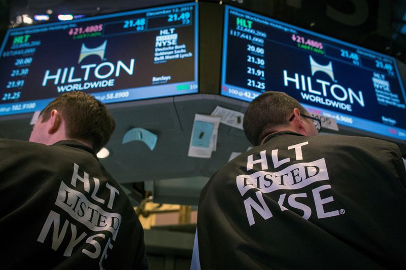 &copy; Reuters. FILE PHOTO: Traders wear special vests for the Hilton IPO on the floor of the New York Stock Exchange December 12, 2013.    REUTERS/Brendan McDermid 