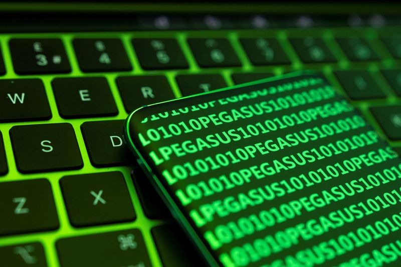 &copy; Reuters. FILE PHOTO: The word Pegasus and binary code are displayed on a smartphone which is placed on a keyboard in this illustration taken May 4, 2022. REUTERS/Dado Ruvic/Illustration/File Photo