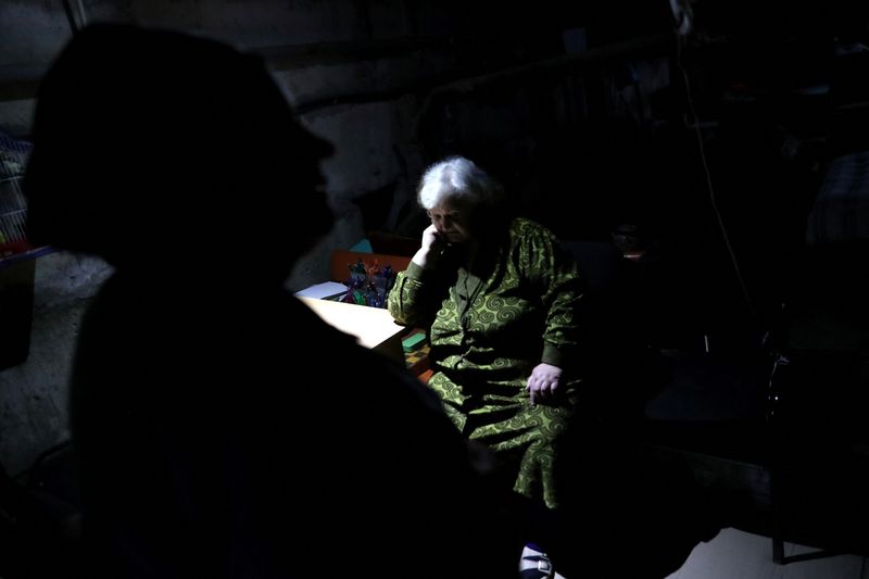 &copy; Reuters. Local residents chat as they stay inside an underground shelter at former Russian-occupied Kutuzivka village, amid Russia's attack on Ukraine, on the outskirts of Kharkiv, Ukraine June 1, 2022. Picture taken June 1, 2022.  To match Special Report UKRAINE-