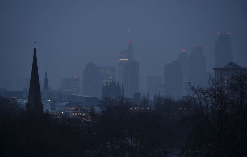 &copy; Reuters. FILE PHOTO: The City of London business district is seen in the distance behind church spires at dawn in London, Britain January 8, 2015. REUTERS/Toby Melville 