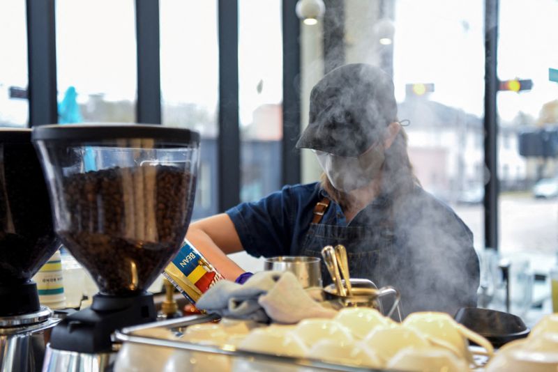 &copy; Reuters. FILE PHOTO: A barista makes coffee for a customer in Houston, Texas, U.S., March 10, 2021. REUTERS/Callaghan O'Hare