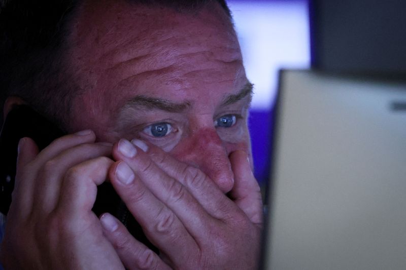 &copy; Reuters. FILE PHOTO: A trader works on the floor of the New York Stock Exchange (NYSE) in New York City, U.S., July 19, 2022.  REUTERS/Brendan McDermid