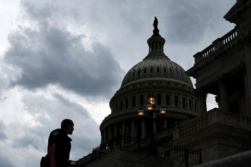 &copy; Reuters. A U.S. Capitol Police officer stands on the Senate steps as storm clouds pass over the U.S. Capitol in Washington, U.S. July 18, 2022.  REUTERS/Jonathan Ernst