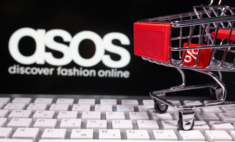 &copy; Reuters. A keyboard and a shopping cart are seen in front of a displayed ASOS logo in this illustration picture taken October 13, 2020. REUTERS/Dado Ruvic/Illustration