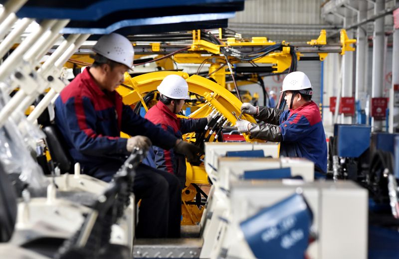 &copy; Reuters. Employees work on a drilling machine production line at a factory in Zhangjiakou, Hebei province, China November 14, 2018. REUTERS/Stringer  ATTENTION EDITORS - THIS IMAGE WAS PROVIDED BY A THIRD PARTY. CHINA OUT.